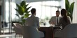 © kwanchaift - A group of business professionals engaged in a discussion about customer loyalty strategies, with a focus on improving service quality.