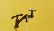 © Montalumirock - Iron faucet pipe with water flow for daily necessities at home solid background