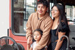 © Martin Stock Studio - Latin american family exploring vintage red bus during day trip