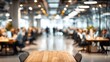 © lan - Blurred background of a modern office interior with blurred business people working in a team at a table. High quality