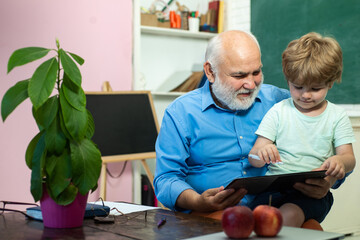 Aufkleber - Grandfather and grandson. Funny little child having fun on blackboard background. Thank You Teacher. Back to school. Old and Young. Teachers day. Grandfather talking to grandson.