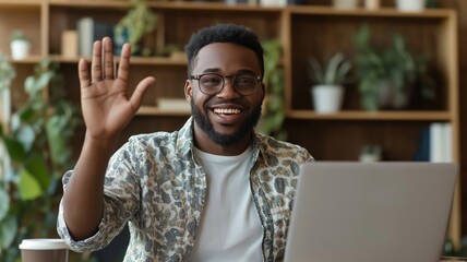 Poster - Person waving hello while using laptop in a cozy workspace surrounded by greenery