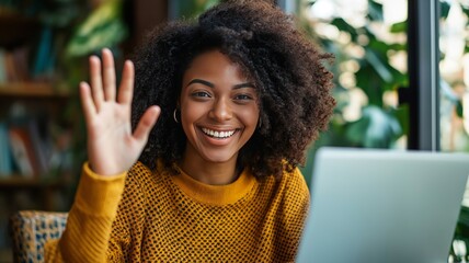 Poster - Person waving hello while working on a laptop in a cozy indoor setting