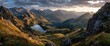 © Alfind - Panoramic sunset view of a serene mountain lake nestled within a rugged, golden-hued valley, the sun casting long shadows across the peaks