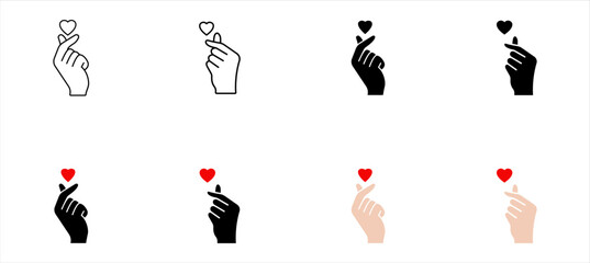 Fototapete - Hand making Korean finger heart symbol with small red heart. Love, affection, K-pop, cute, trendy icon.
