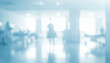 © al-sultan - Blurred hospital interior with figures in the background light blue and white.