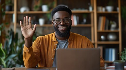 Poster - Professional waving hello while working on laptop in a modern workspace