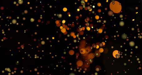 Poster - Glittering cluster of glowing circular orbs drifting across virtual canvas, with warm bokeh lights