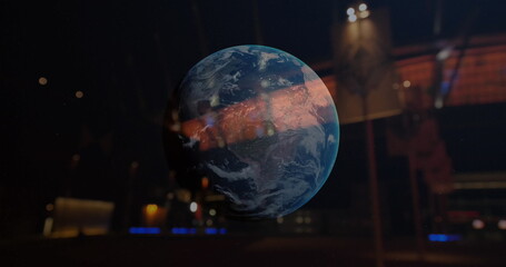 Poster - Displaying translucent holographic Earth floating inside control room, with monitors and keyboards