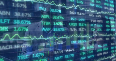 Poster - Gesturing male analyst in suit leaning toward transparent screen at office, with stock tickers