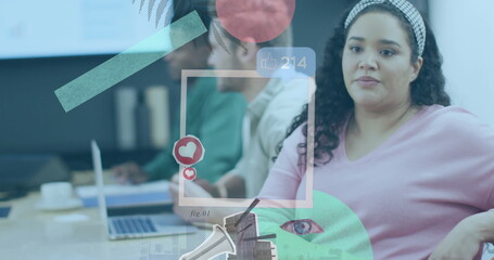 Poster - Listening Hispanic woman wearing pink sweater at conference table with notebook, copy space