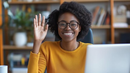Poster - Person waving hello while sitting at a laptop in a bright workspace filled with books and plants