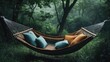 © Lasvu - A hammock with pillows in a secluded green place, resting with empty copy space for text.