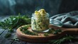 © Lasvu - A vertical shot of herbs butter in a glass container on a wooden board