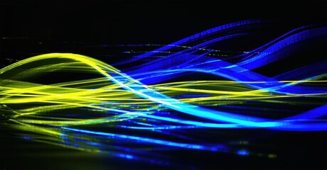 Poster - Abstract light streaks, vibrant blue, yellow hues. Dynamic energy flows across dark background. Modern digital art impression.