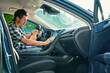 © Lazy_Bear - Man cleaning car dashboard with microfiber cloth and spray bottle. Concept of auto interior maintenance, vehicle disinfection and car hygiene