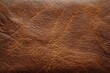 © PONPES ASSAIF - Detailed shot of textured brown leather showing its grain and surface variations