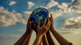 A striking, unified image of diverse hands raising a realistic Earth globe against a vibrant blue sky with soft clouds