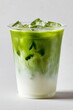 © overrust - a transparent plastic cup filled with iced matcha latte