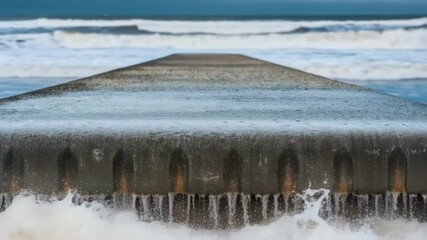 Poster - Ocean waves crashing over concrete breakwater