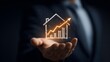 © tonifrito - Businessman holding increasing home value chart in hand