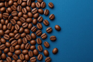 Poster - Coffee beans displayed on a blue surface with grains prepared for brewing.