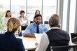 © NVB Stocker - Human resources : company, successful deal. Human resources manager interviewing applicant at modern office.  Indian man candidate job interviewing and answering question hr CV recruiter
