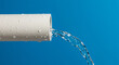 © Iuliia - Stream of water from plastic pipe. Plumbing system, water dropping on blue background. No blockage in pipe
