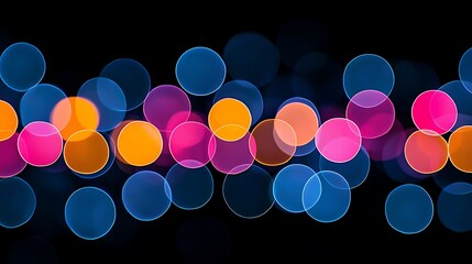 Abstract background with colorful bokeh lights pink orange and blue circles on black