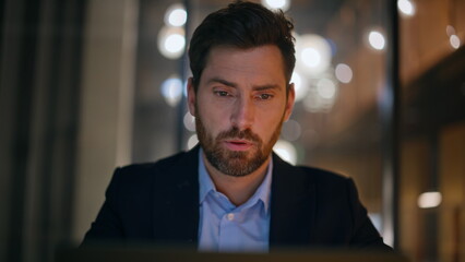 Poster - Serious startuper working evening office looking laptop closeup. Tensed manager