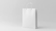 © Helen-HD - A crisp white paper bag stands upright against a light gray background, showcasing its simplicity and clean lines in minimalist design
