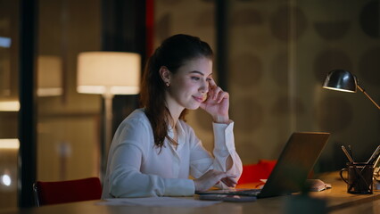 Poster - Hardworking woman typing laptop at evening office closeup. Serious businesswoman
