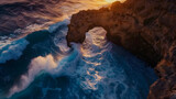 Majestic sea arch formation with waves crashing b