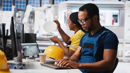 Poster - african american industrial technician assesses system health in solar facility, using software tool