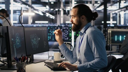 Poster - Data center system administrator talking with coworker in office while doing software updates. Server room IT expert and colleague chatting, optimizing infrastructure rackmounts configuration, camera