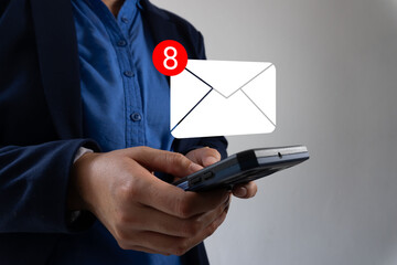 Poster - A person holding a cellphone with his hand on it, showing that he has just checked for new mail in his email application.