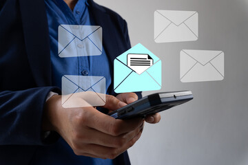 Poster - Close-up of a businessman's hand holding a smartphone with an email icon and message envelope floating on the screen,