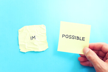 Poster - The word impossible is divided into two parts. success and challenge concept.