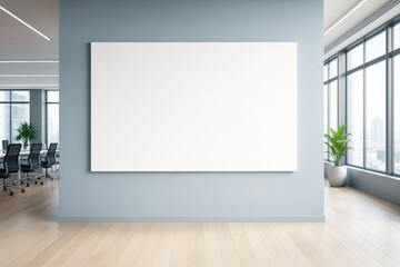 Poster - Blank white canvas on light blue wall in modern office interior with wooden floor, large windows, and copy space for branding or presentation.