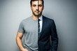 © Pixels Hunter - Split image of a man in casual t-shirt and formal suit showing contrast of personal and professional appearance on neutral background light.