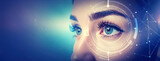 Close up human eye with hologram data.