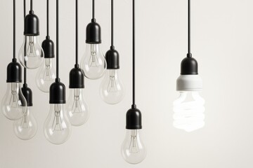 Aufkleber - Hanging lightbulbs with one lit spiral bulb symbolizing innovation and modern technology on neutral background. Ai generative.