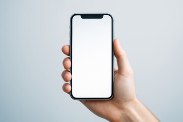 Aufkleber - Close-up of hand holding smartphone with blank screen against light background for mockup or template use in advertising or technology concept.