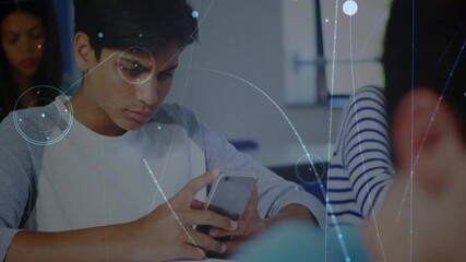 Poster - Classroom student tapping smartphone, activating network overlay while peer writing notes