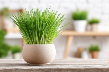 Poster - Vibrant green grass plant in a minimalist beige pot on wooden surface in modern home decor scene