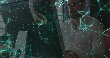 Poster - Senior man seated desk facing screen while network materializing rotating globe for data analysis