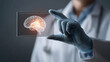 © Anthichada - Hand of a doctor in gloved holding a glowing digital human brain inside transparent card in a clinic