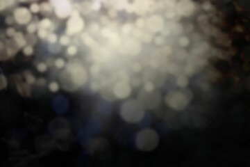 Poster - Abstract circular light spots are floating over dark blurred background, flat design