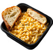 © MstRojoni - Creamy macaroni and cheese paired with a slice of garlic bread, placed in a black plastic rectangular parcel box isolated on white and transparent background.