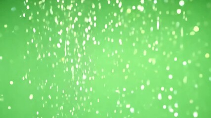 Poster - Falling particles on green background: Sparkling white particles gently cascade against a vivid green canvas, creating a mesmerizing and serene effect.
